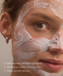 Close-up of a womans face with Refining Mask applied, skin appears smooth. Text: 99% naturally derived ingredients; delivers an instant blurring effect; infused with ceramides to help smooth texture.