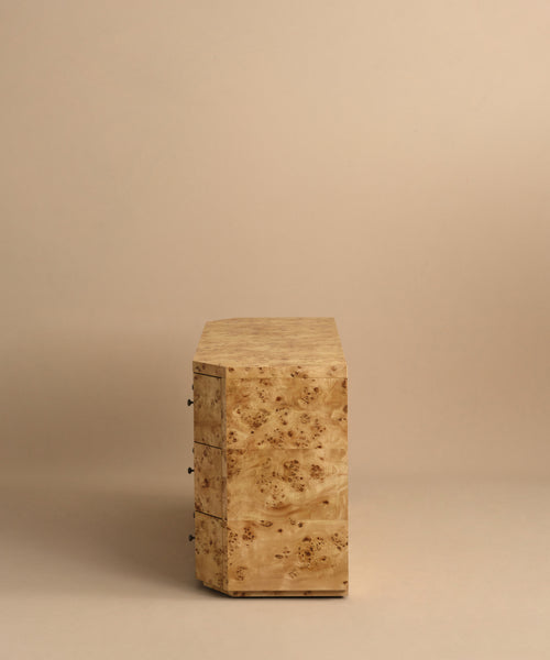 The Carbon Dresser is a modern bedroom furniture piece with a natural burlwood finish and soft-close drawers, shown from the side and front against a plain beige background.