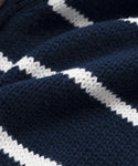 Close-up of navy blue knit fabric with diagonal ivory stripes, showcasing its texture and weave—ideal for creating the Chloe Cardigan.