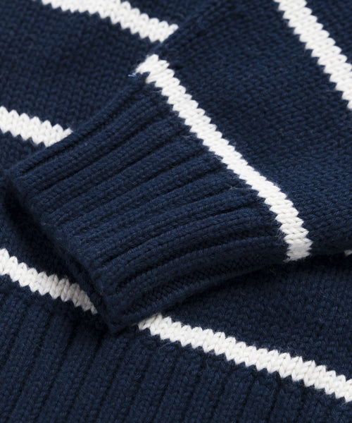 Close-up of the Chloe Cardigan in navy/ivory with white horizontal stripes and a ribbed sleeve cuff—ideal for warm-weather wear.