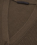 Close-up of the Cashmere Cocoon Cardigan, a brown ribbed knit oversized cashmere piece with a V-neck, single button closure, and a black label at the collar. The soft fabric’s texture is clearly visible.
