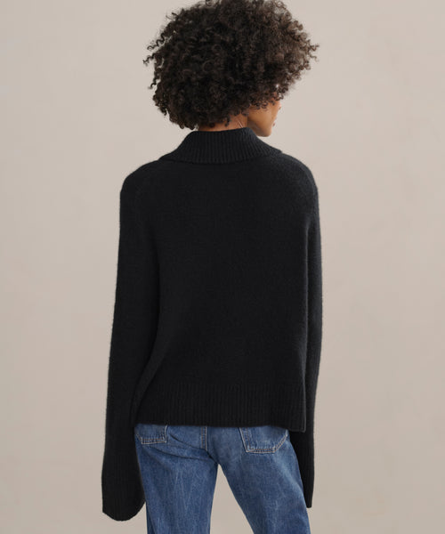 Relaxed knit polo with wide sleeves, and ribbed trimmings.