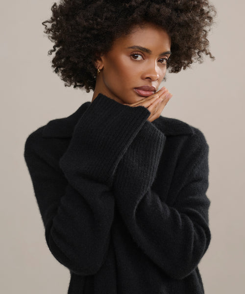 Wide bell sleeves with ribbed trimmings.