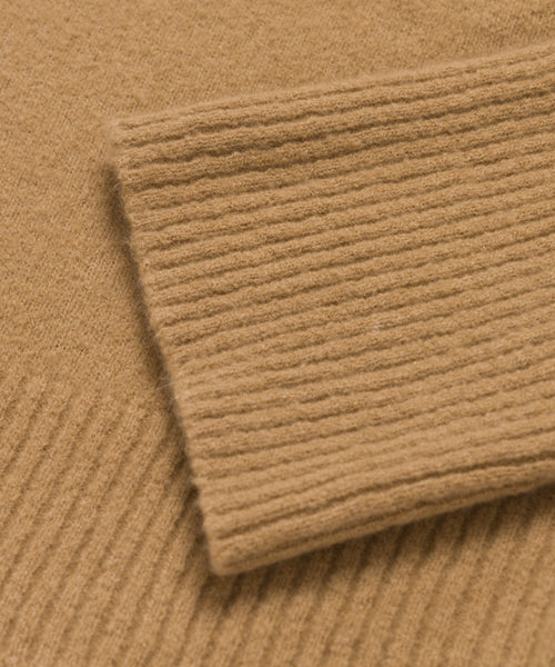 Close-up of the Cashmere Stevie Polo in camel, highlighting its ribbed texture and detailed cuff for a cozy, refined look.