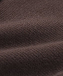 Close-up of brown textured fabric with a visible knit pattern and soft folds, ideal for showcasing the structured silhouette and versatile style of the Cooper Cardigan.