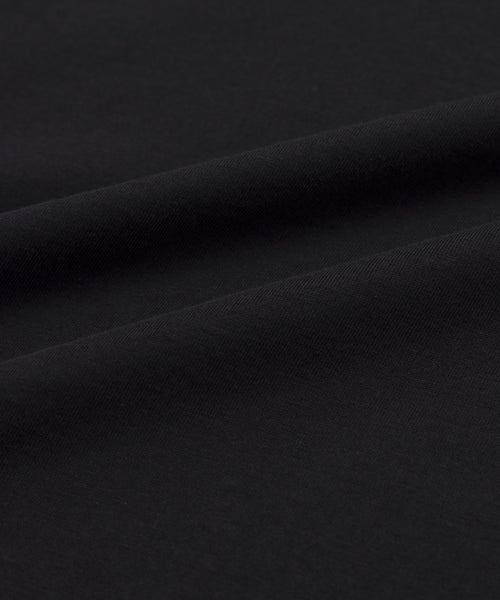 Close-up of the Crosby Tee’s premium jersey cotton fabric, highlighting its smooth texture, gentle folds, soft shadows, and matte finish—ideal for the tee’s relaxed fit.