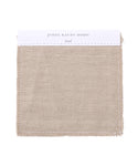 A square Fabric Swatch Sand Hemp from Jenni Kayne Home, in a neutral sand shade with lightly frayed edges and a white header—ideal for previewing upholstery for the Dume Sofa.