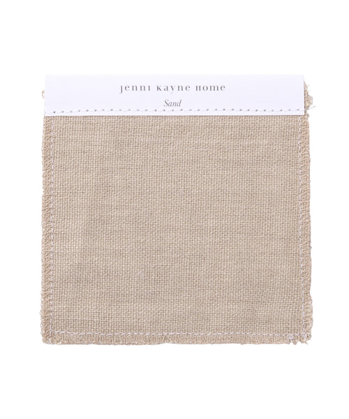A square Fabric Swatch Sand Hemp from Jenni Kayne Home, in a neutral sand shade with lightly frayed edges and a white header—ideal for previewing upholstery for the Dume Sofa.