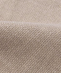 Close-up of a Fabric Swatch Sand Hemp with a visible textured pattern and soft fold, highlighting its natural look as seen on the Dume Sofa.
