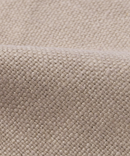 Close-up of a Fabric Swatch Sand Hemp with a visible textured pattern and soft fold, highlighting its natural look as seen on the Dume Sofa.