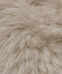 Close-up of Fabric Swatch Light Taupe Shearling, featuring soft, fluffy, long wavy strands for a textured and cozy look similar to Icelandic sheep shearling found in Jenni Kayne Furniture.