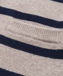 Close-up of the Cooper Cardigan, showing its structured silhouette, textured knit fabric, horizontal taupe and navy stripes, and a small rectangular pocket on the beige section.