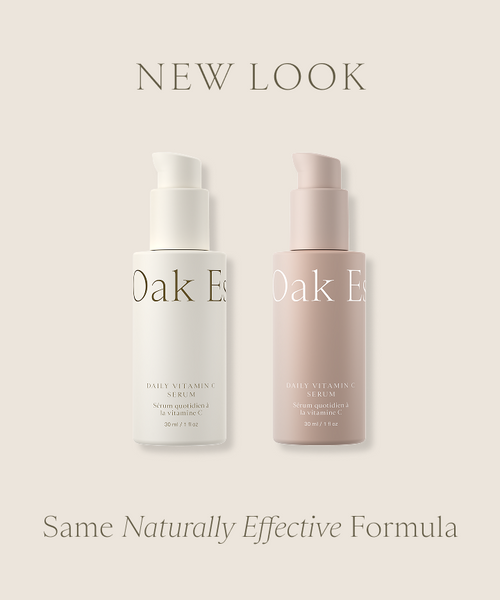 Two bottles of Daily Vitamin C Serum, one white and one blush pink, are shown side by side on a beige background with text saying NEW LOOK and Same Naturally Effective Formula for fading dark spots.