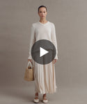Thumbnail for video: Model wearing Cashmere Kate V-Neck and Pleated Skirt.