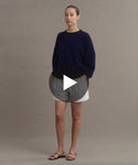Thumbnail for video: Model wearing Cashmere Marina Crewneck in Dark Navy.