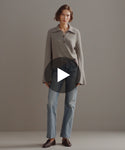 Thumbnail for video: Model walking in-studio wearing Stevie Cashmere Polo.