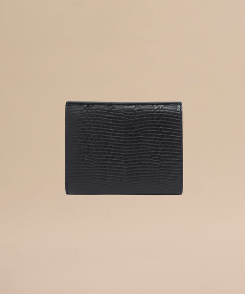 The Reece Leather Wallet is a mid-size black accessory crafted from textured leather with a subtle lizard skin pattern, shown on a plain beige background.