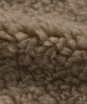 Close-up of the Fabric Swatch Oatmeal Sherpa, featuring textured beige, curly, and soft fibers—ideal for a cozy feel on your Aspen Sofa or Aspen Chair.
