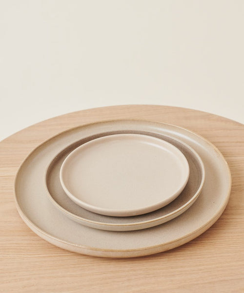 A stack of Pacific Platters rests on the table, each stoneware serving platter perfect for any gathering.
