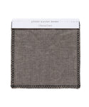 A square swatch of Charcoal Linen with black stitched edges, labeled “Fabric Swatch Charcoal Linen” on a white tag at the top—a signature touch for Jenni Kayne Furniture.